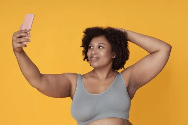 A person taking a selfie, highlighting their stretch marks with confidence. They are smiling and making eye contact with the camera, projecting an image of self-acceptance and empowerment. The background is a cozy, personal space, emphasizing the importance of self-love at home.