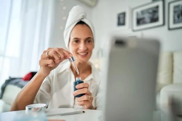A woman applying a hydrating serum to her face with a dropper. The background is a well-lit bathroom with skincare products.