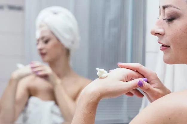 A close-up of a woman's hands gently washing her face with a creamy cleanser in a bathroom sink. Water is splashing softly.