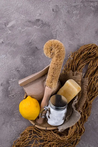 Close-up of different exfoliating tools: a sugar scrub, a konjac sponge, and an electric facial brush. The image showcases the variety of options available for physical exfoliation and highlights their different textures.