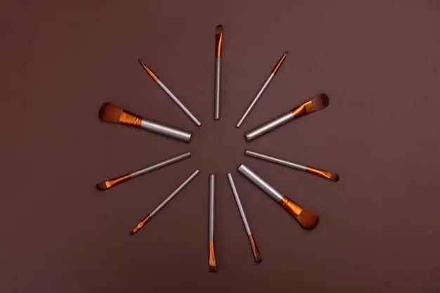 A collection of different bronzer brushes, including an angled brush, a tapered brush, and a kabuki brush, displayed against a neutral background to showcase their shapes and bristles.