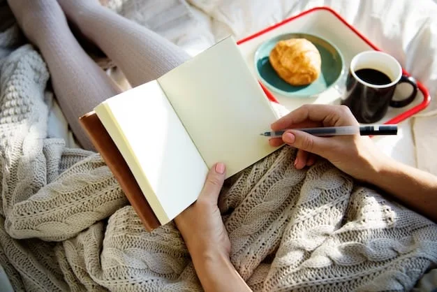 A close-up shot of a person's hands writing in a journal on a Sunday morning, with a cup of tea and a cozy blanket nearby, emphasizing intentionality and planning for the week ahead.