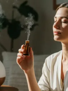Woman relaxing with essential oil for Sunday aromatherapy