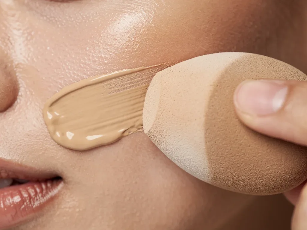 Blending foundation over underpainting with a beauty blender