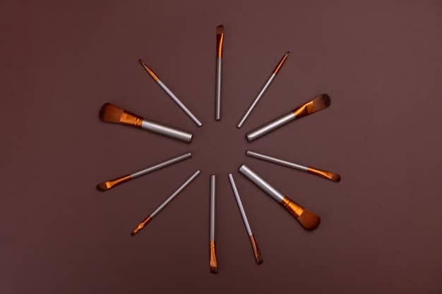 A collection of different bronzer brushes, including an angled brush, a tapered brush, and a kabuki brush, displayed against a neutral background to showcase their shapes and bristles.