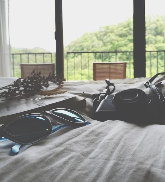 An organized and inviting bedroom setup with dim lighting, clean bedding, and a humidifier, creating a peaceful and conducive environment for sleep.