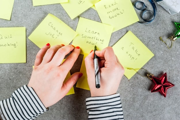 Close-up shot of a hand writing affirmations on colorful sticky notes to be added to a vision board.