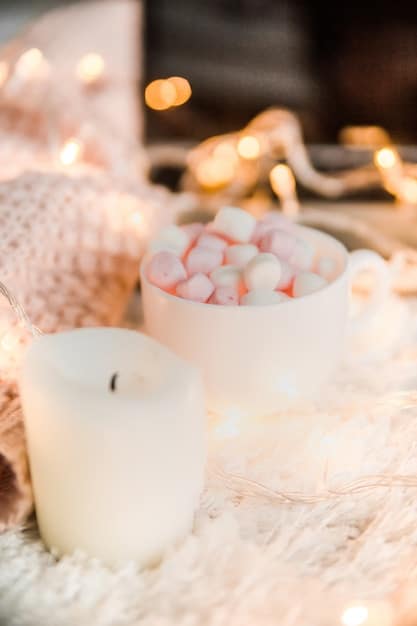 A close-up of a lit aromatherapy diffuser surrounded by small candles, creating a warm, inviting glow and filling the air with a calming fragrance.