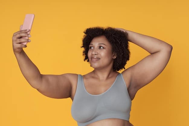 A person taking a selfie, highlighting their stretch marks with confidence. They are smiling and making eye contact with the camera, projecting an image of self-acceptance and empowerment. The background is a cozy, personal space, emphasizing the importance of self-love at home.
