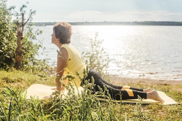 A person performing a gentle stretching pose in a sunlit park, perhaps near a lake or trees. They are wearing comfortable clothing, and their expression is serene, embodying peaceful and joyful movement.