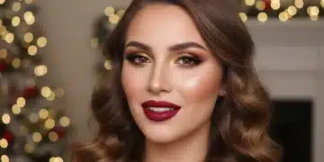 Glamorous holiday makeup look with red lipstick and gold eyeshadow for December 2026 parties.