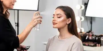 Professional makeup artist applies setting spray for long-lasting makeup, 2026 trends